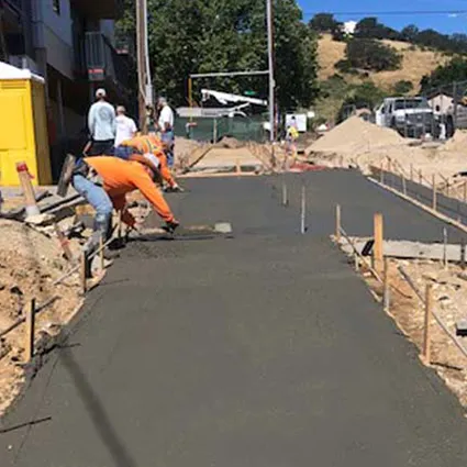 Constructin Workers pouring a concrete driveway in Pas Robles CA