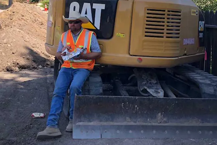 Wilber Construction Paso Robles California Worker leaning on Bulldozer Wilber Construction Paso Robles California Worker leaning on Bulldozer