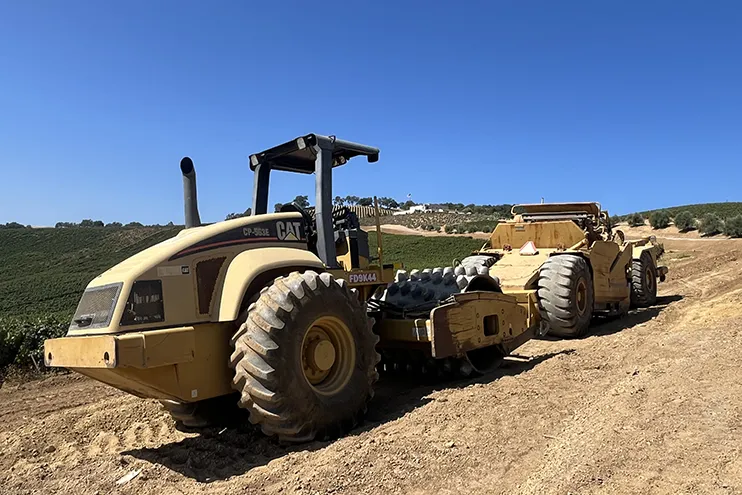 Wilber Construction CAT Earthmover working in a vinyard Wilber Construction CAT Earthmover working in a vineyard