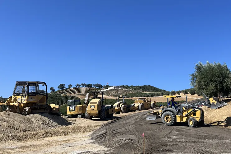 Wilber Construction leveling road with construction equipment in a vineyard in California 2 Wilber Construction leveling road with construction equipment in a vineyard in California 2